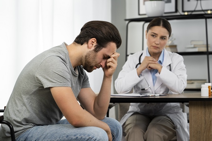 side view sad man doctor s appointment